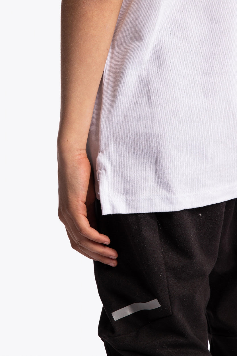 Osaka kids polo in white with logo in black. Detail view side