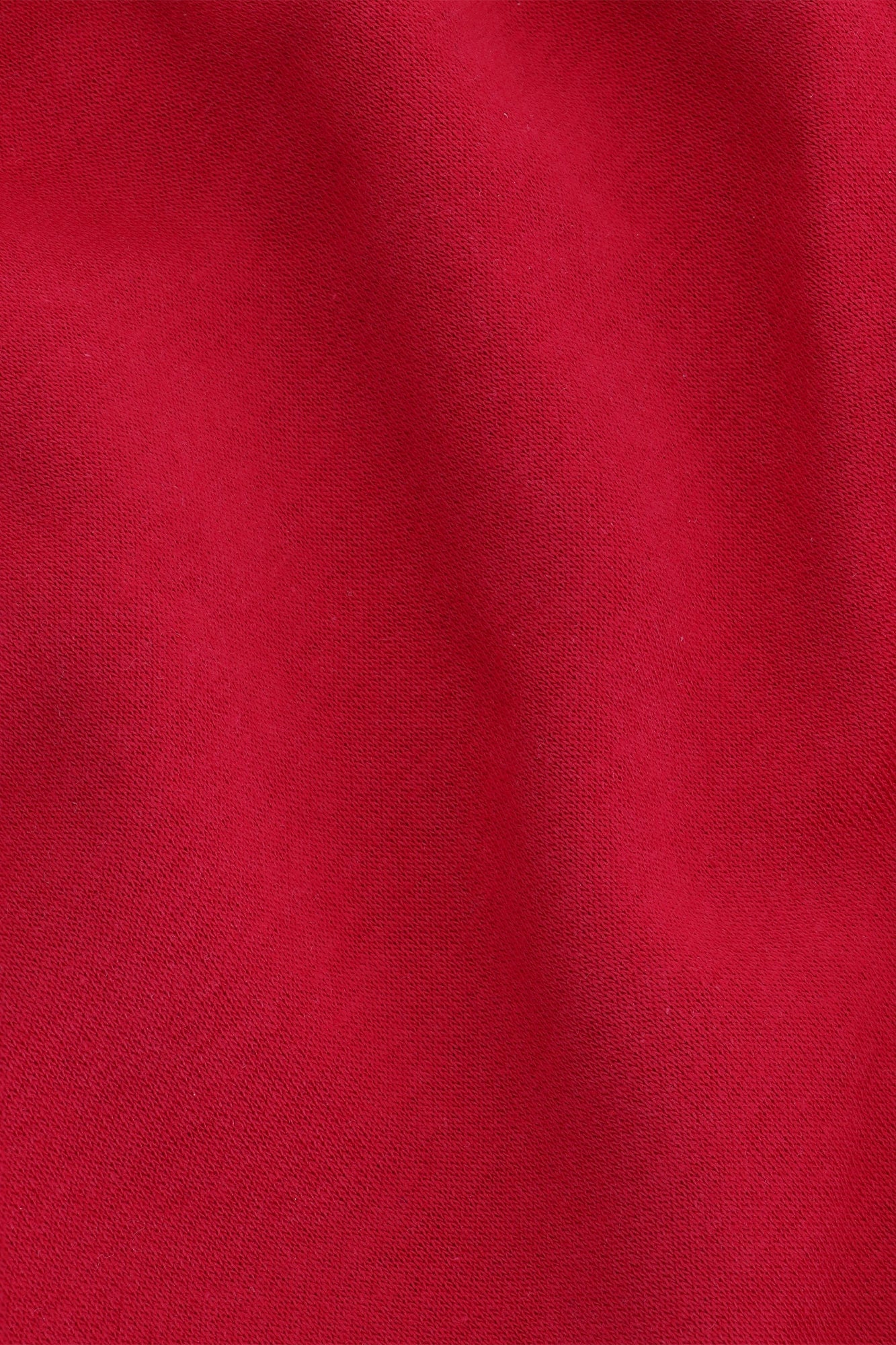 Osaka women shorts in red with logo in white. Front detail fabric view