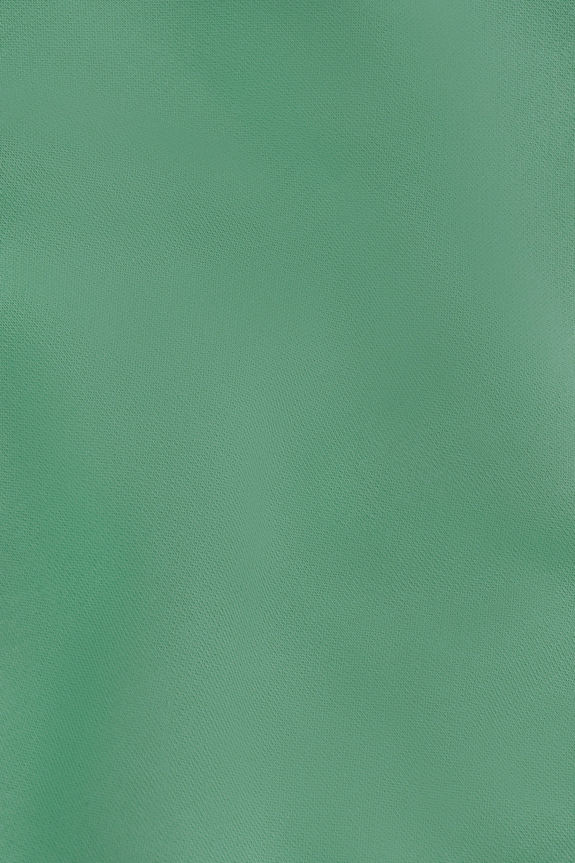 Osaka women sweater in green with logo in white. Detail fabric view