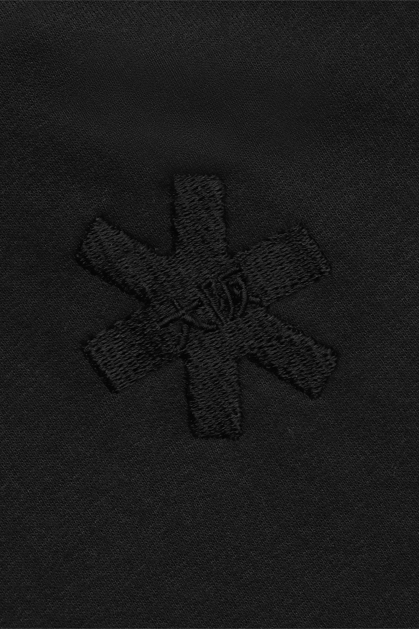 Osaka women cropped hoodie in black with college logo in white. Back detail logo view