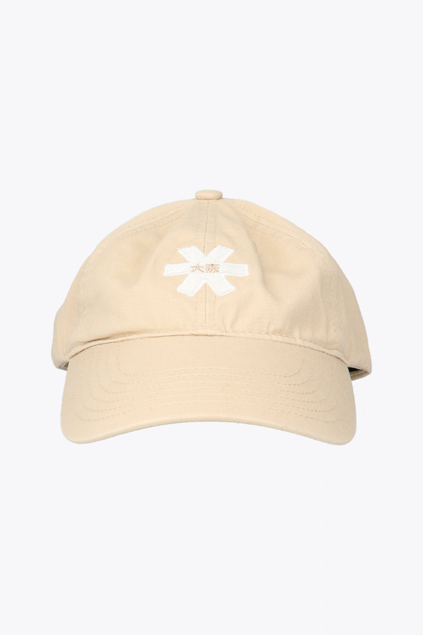Osaka baseball cap in sand with logo in white. Side view