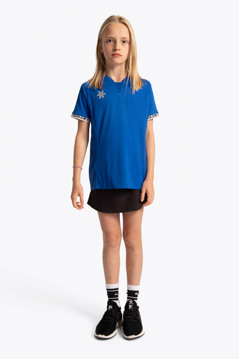 Girl wearing the Osaka Kids Jersey in Royal blue. Front view
