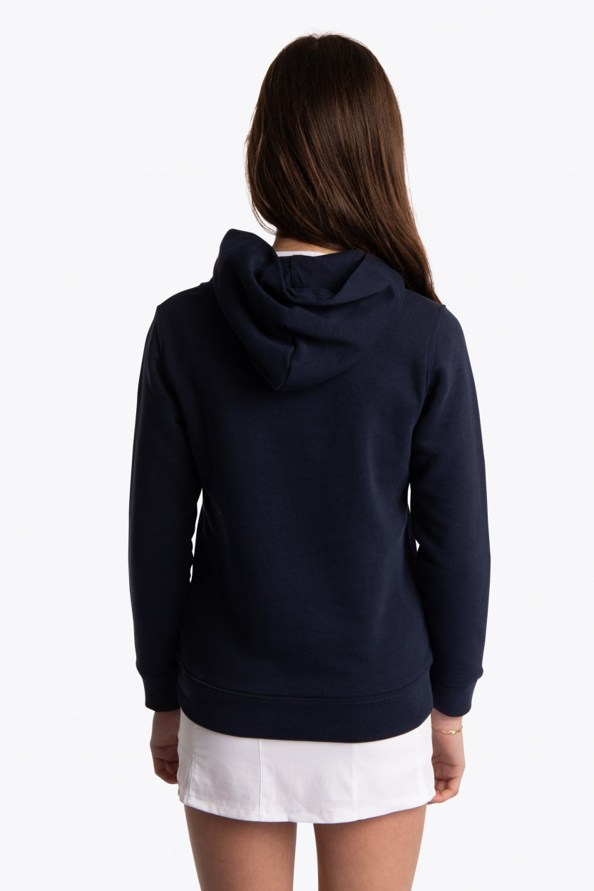 Girl wearing the Osaka kids hoodie in navy with blue star logo. Back view