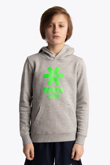 Boy wearing the Osaka kids hoodie in grey with green star logo. Front view