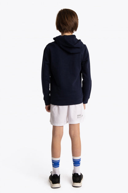 Boy wearing the Osaka kids hoodie in navy with pink star logo. Back view
