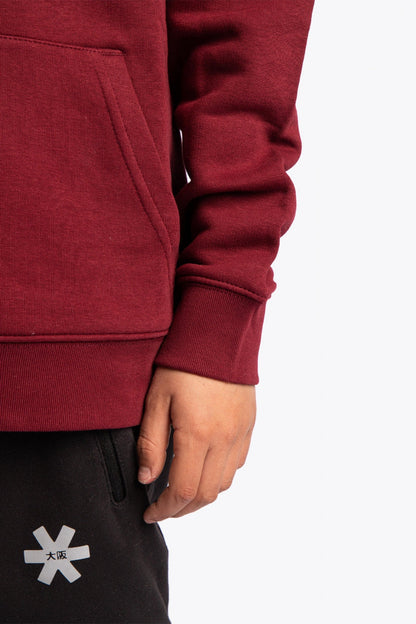 Osaka kids vintage hoodie in burgundy with logo in orange. Detail view sleeve