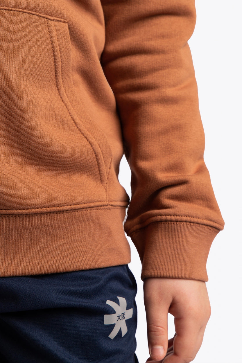 Osaka kids vintage hoodie in caramel with logo in white. Detail view sleeve