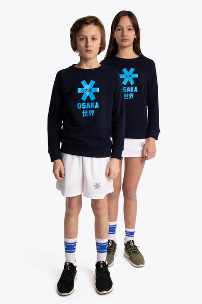 Boy and girl wearing the Osaka kids sweater in navy with logo in blue. Front full view