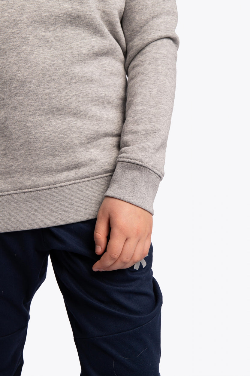 Osaka kids pacs sweater in navy with multicolor logo pac-man style. Detail view sleeve