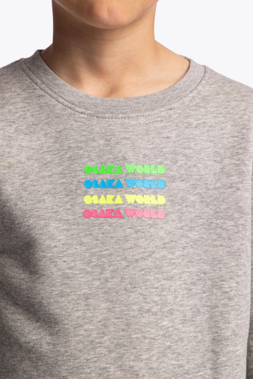 Osaka kids pacs sweater in navy with multicolor logo pac-man style. Detail view logo