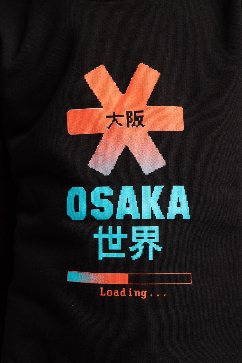 Osaka kids pixo sweater in black with orange and blue logo. Detail view logo