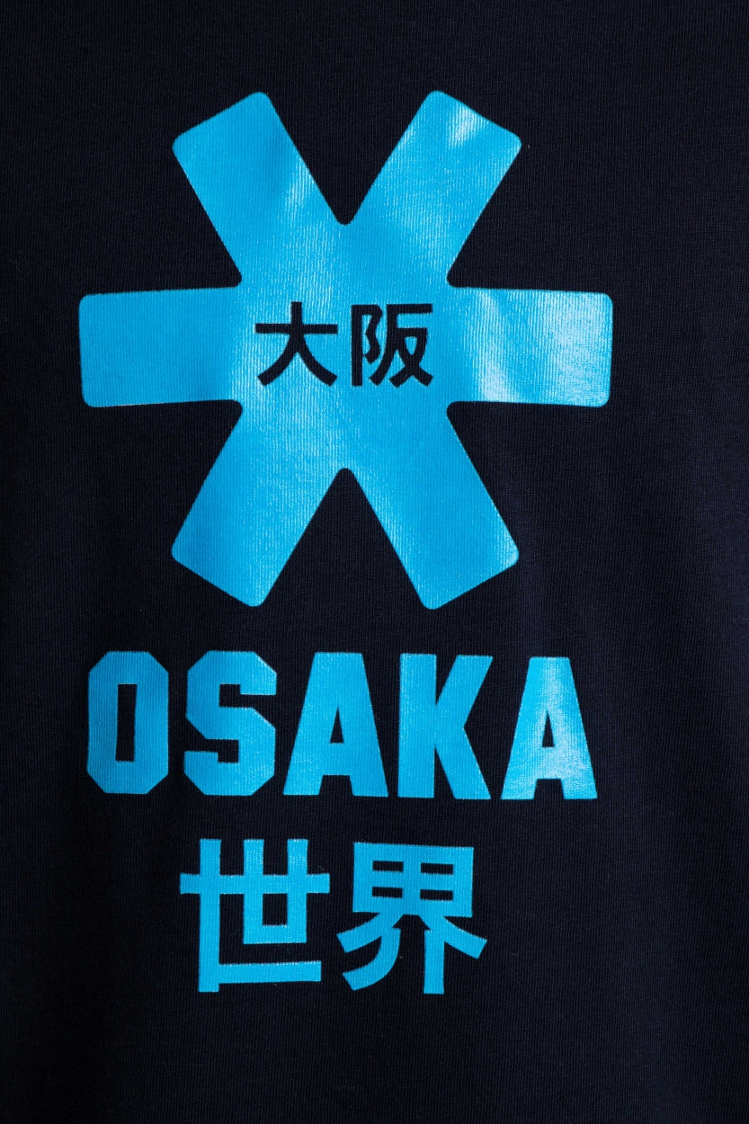 Osaka kids tee short sleeve navy with logo in blue. Detail view logo