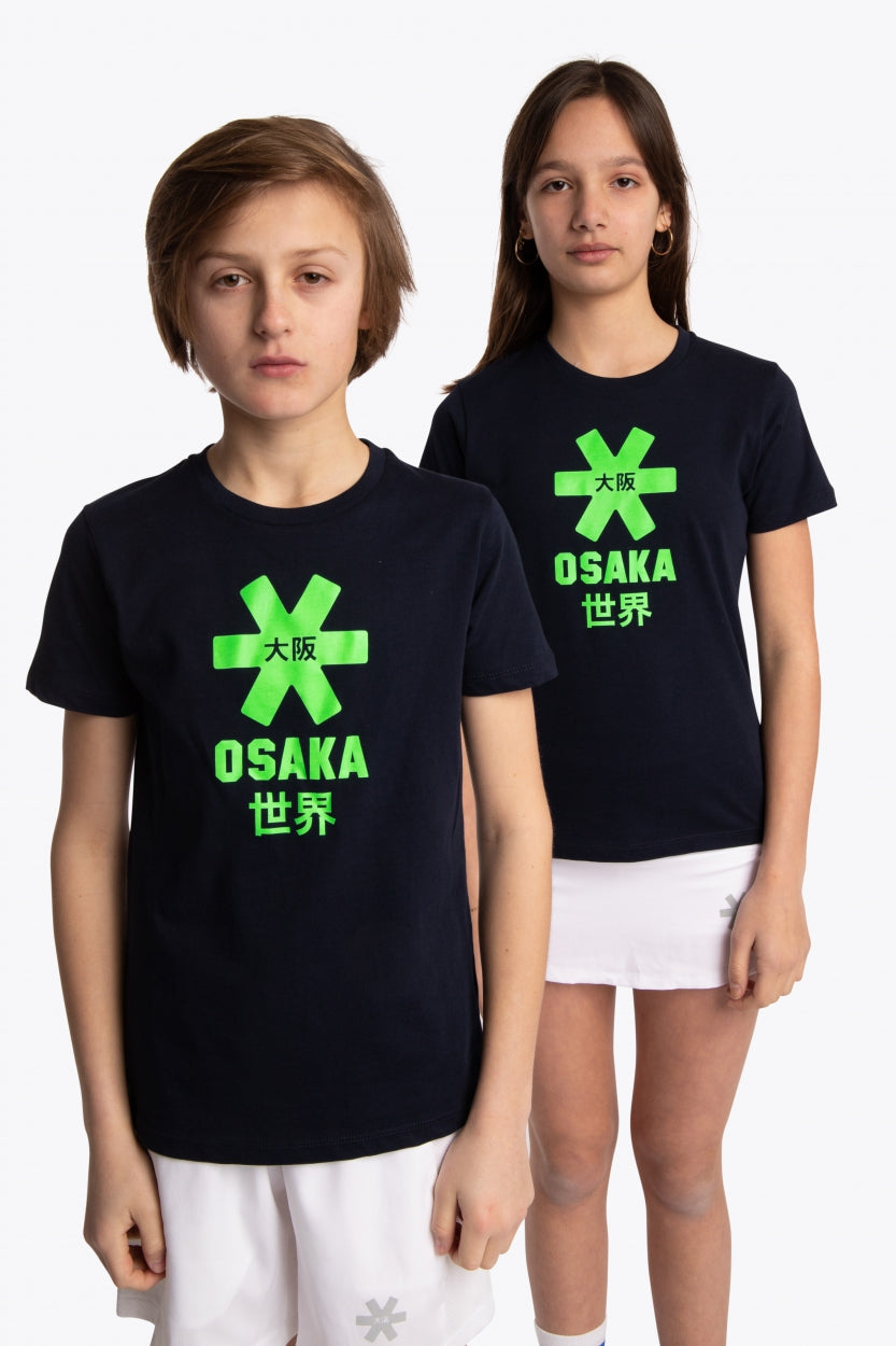 Boy and girl wearing the Osaka kids tee short sleeve navy with logo in green. Front view