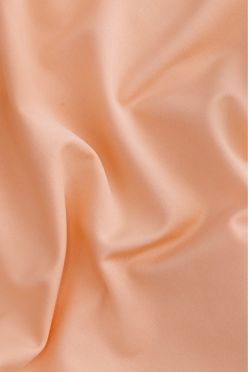 Osaka women ball skort in peach with logo in grey. Detail fabric view