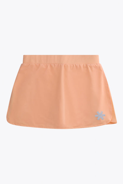 Osaka women ball skort in peach with logo in grey. Front flatlay view
