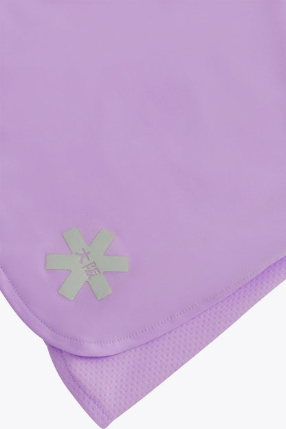 Osaka women ball skort in light purple with logo in grey. Detail logo view