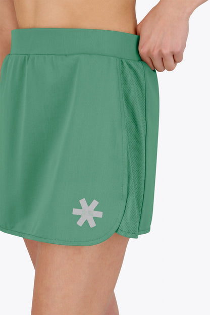 Osaka women ball skort in green with logo in grey. Detail logo view