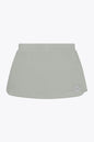 Osaka women ball skort in light grey with logo in grey. Front flatlay view