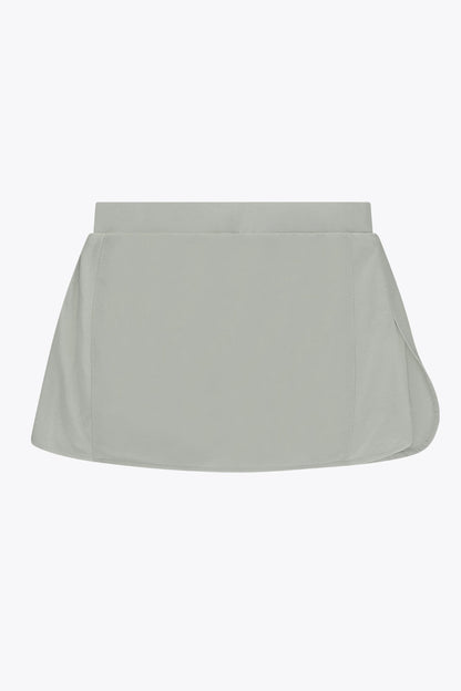 Osaka women ball skort in light grey with logo in grey. Back flatlay view