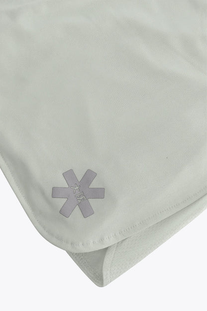 Osaka women ball skort in light grey with logo in grey. Detail logo view