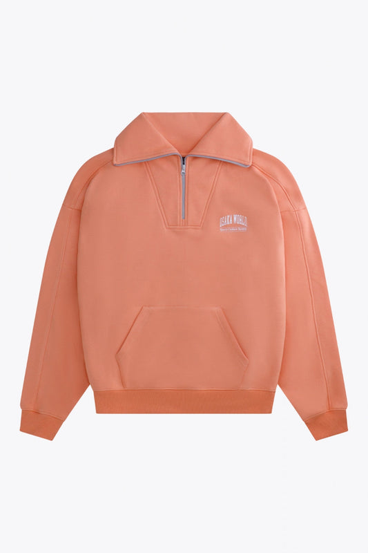 Osaka women half zip sweater in peach with white logo. Front flatlay view