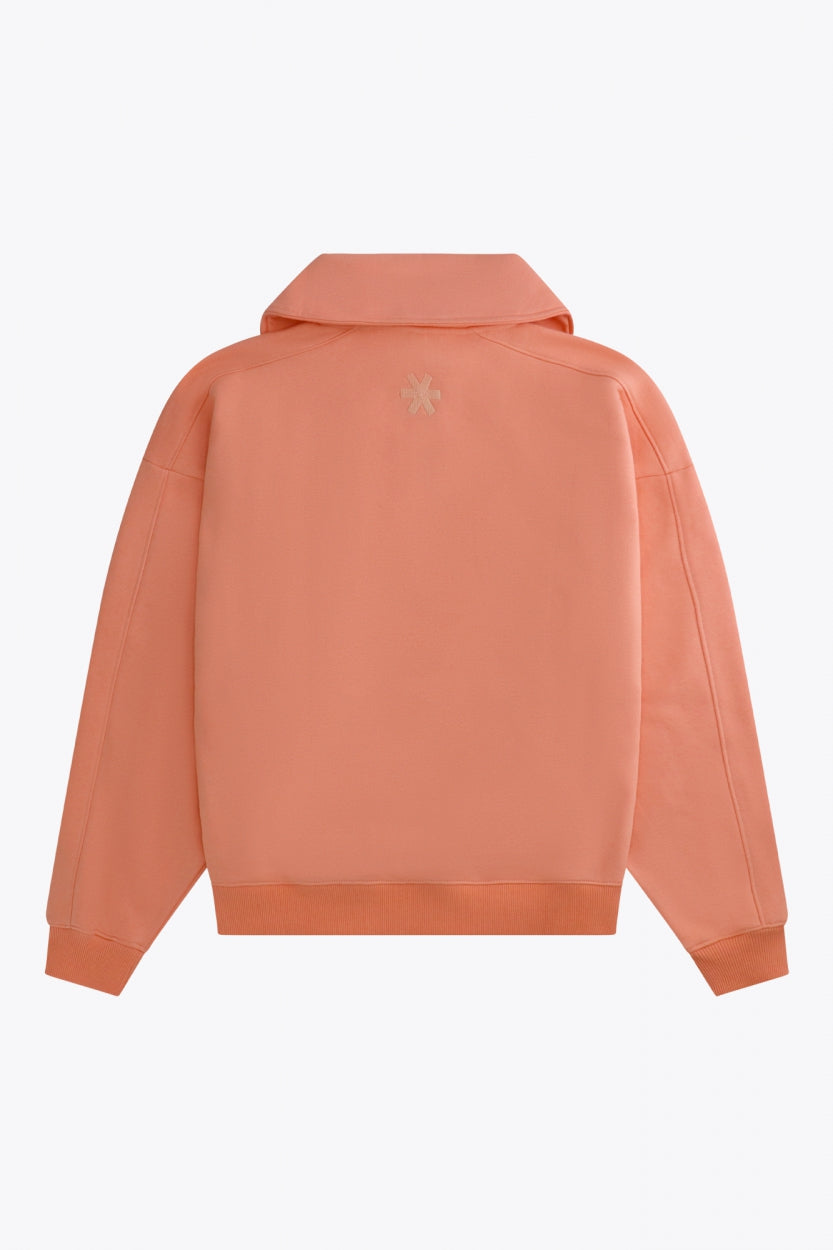 Osaka women half zip sweater in peach with white logo. Back flatlay view