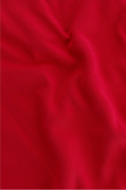 Osaka women half zip sweater in red with white logo. Detail fabric view