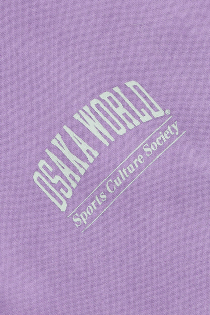 Osaka women half zip sweater in light purple with white logo. Detail logo view