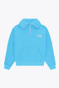 Osaka women half zip sweater in light blue with white logo. Front flatlay view