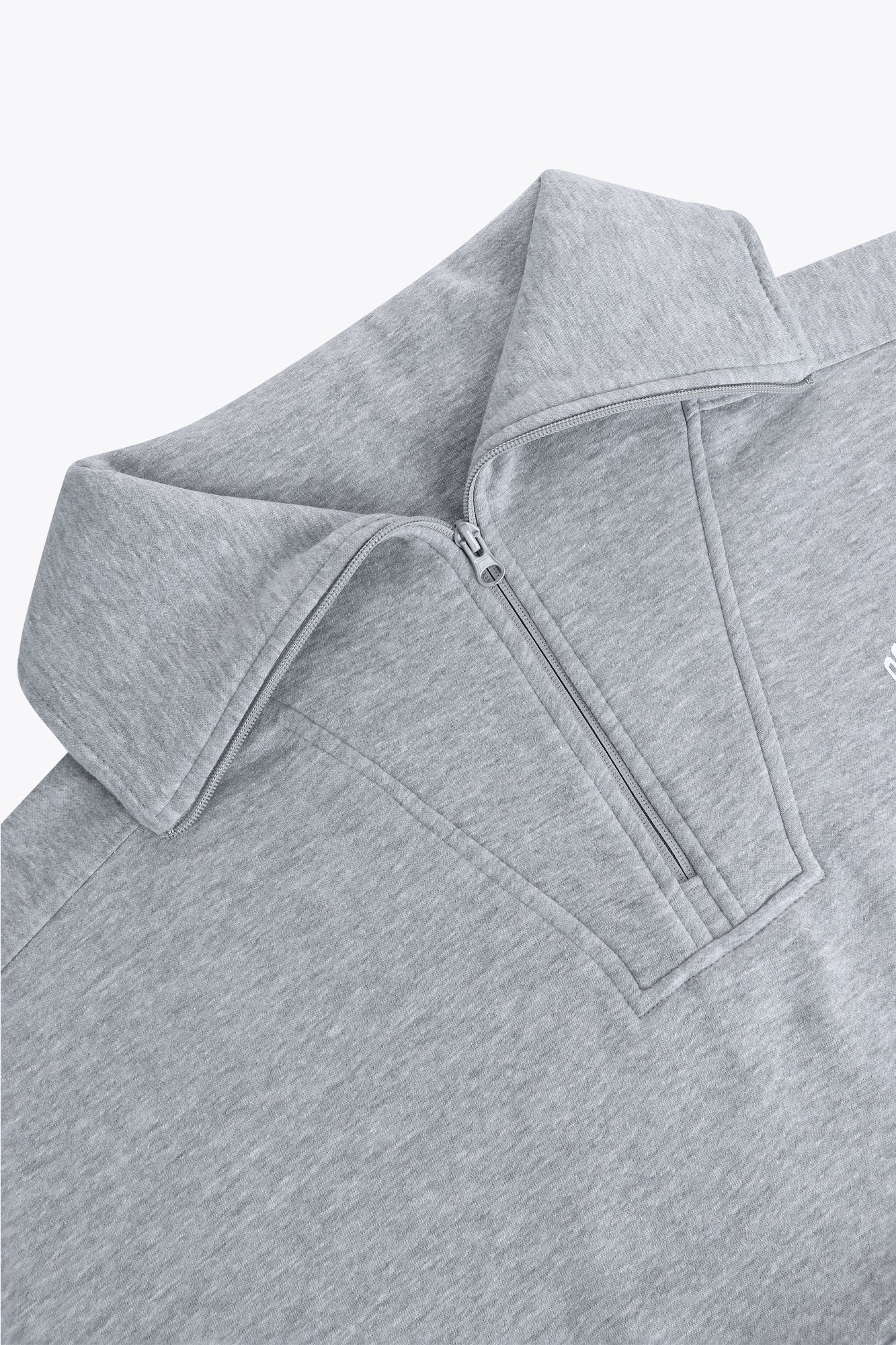 Osaka women half zip sweater in heather grey with white logo. Front detail flatlay neck view