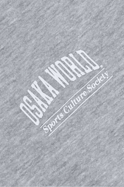 Osaka women half zip sweater in heather grey with white logo. Detail logo view
