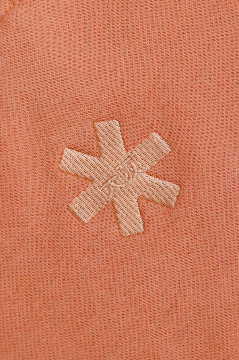 Osaka women hoodie in peach with white logo. Back detail logo view