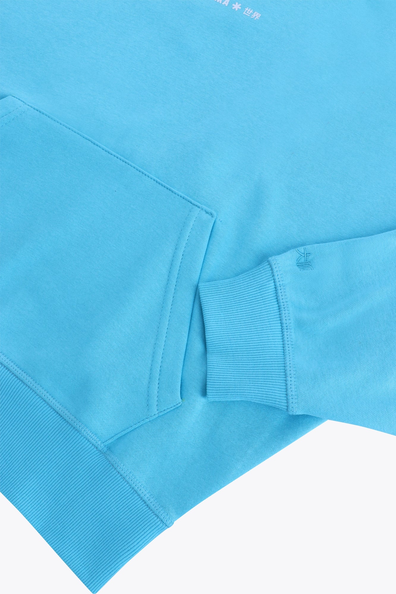 Osaka women hoodie in light blue with white logo. Front detail sleeve view