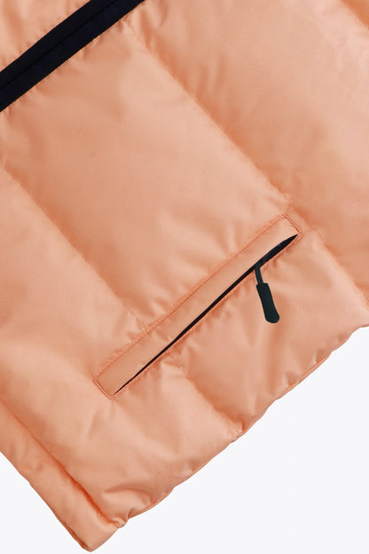 Osaka women padded gilet in peach with grey logo. Front detail pocket view