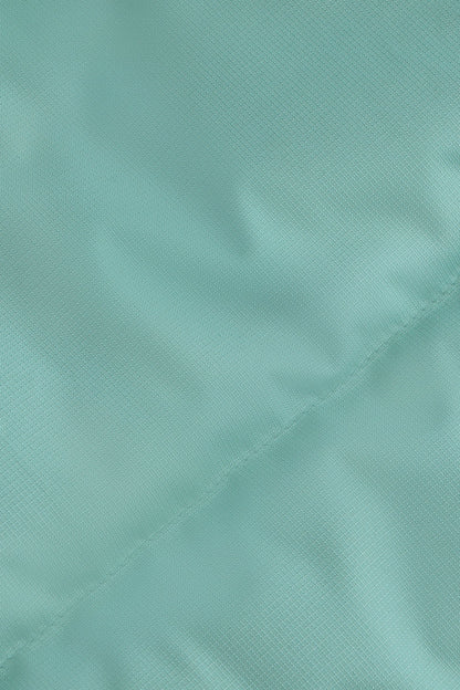 Osaka women padded gilet in green with grey logo. Detail fabric view