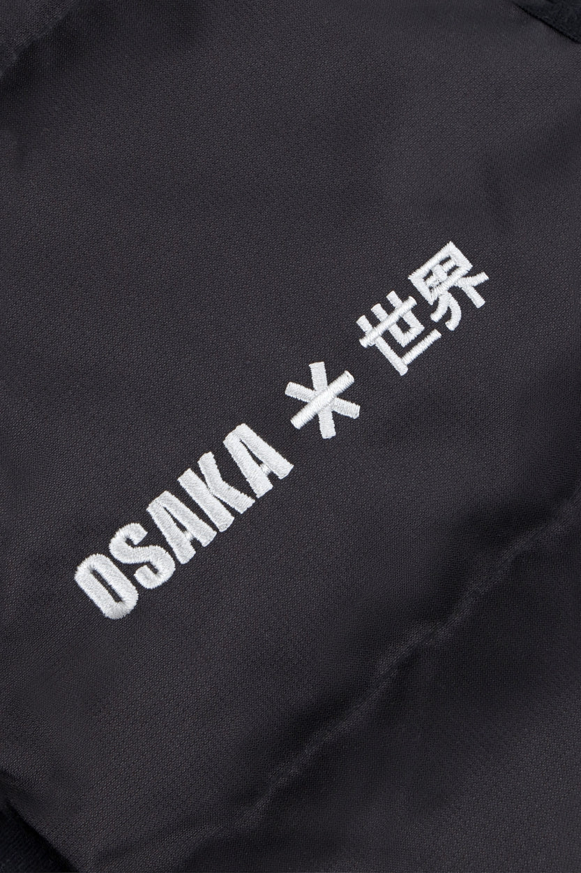 Osaka women padded gilet in black with white logo. Front detail logo view