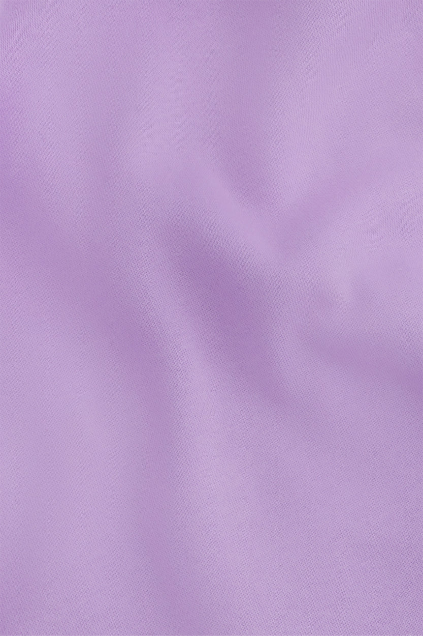 Osaka women shorts in light purple with logo in white. Front flatlay detail fabric view