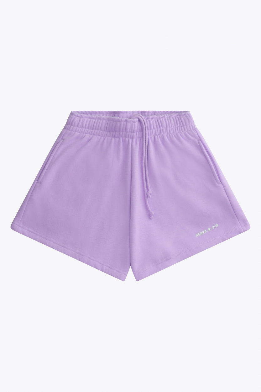 Osaka women shorts in light purple with logo in white. Front flatlay view