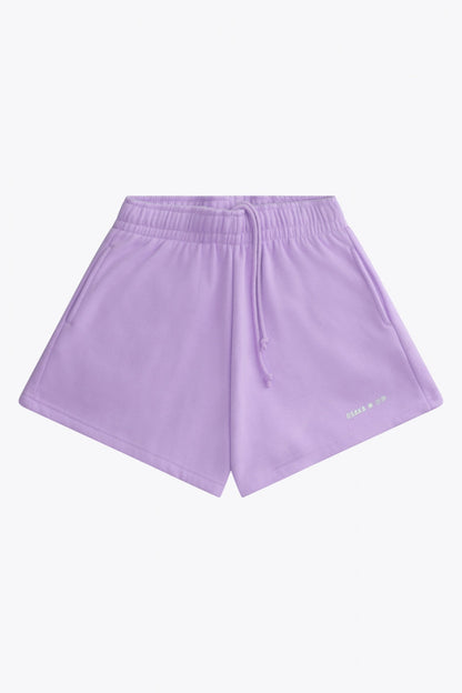 Osaka women shorts in light purple with logo in white. Front flatlay view