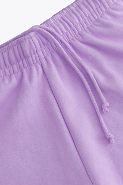 Osaka women shorts in light purple with logo in white. Front detail cords view
