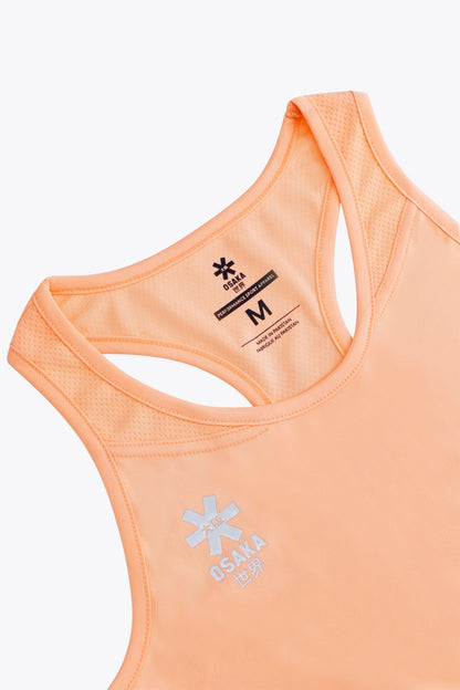 Osaka women singlet in peach with logo in grey. Front flatlay detail view