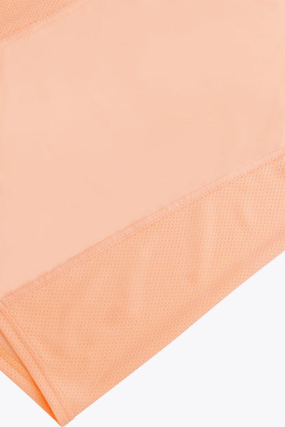 Osaka women singlet in peach with logo in grey. Fabric detailview