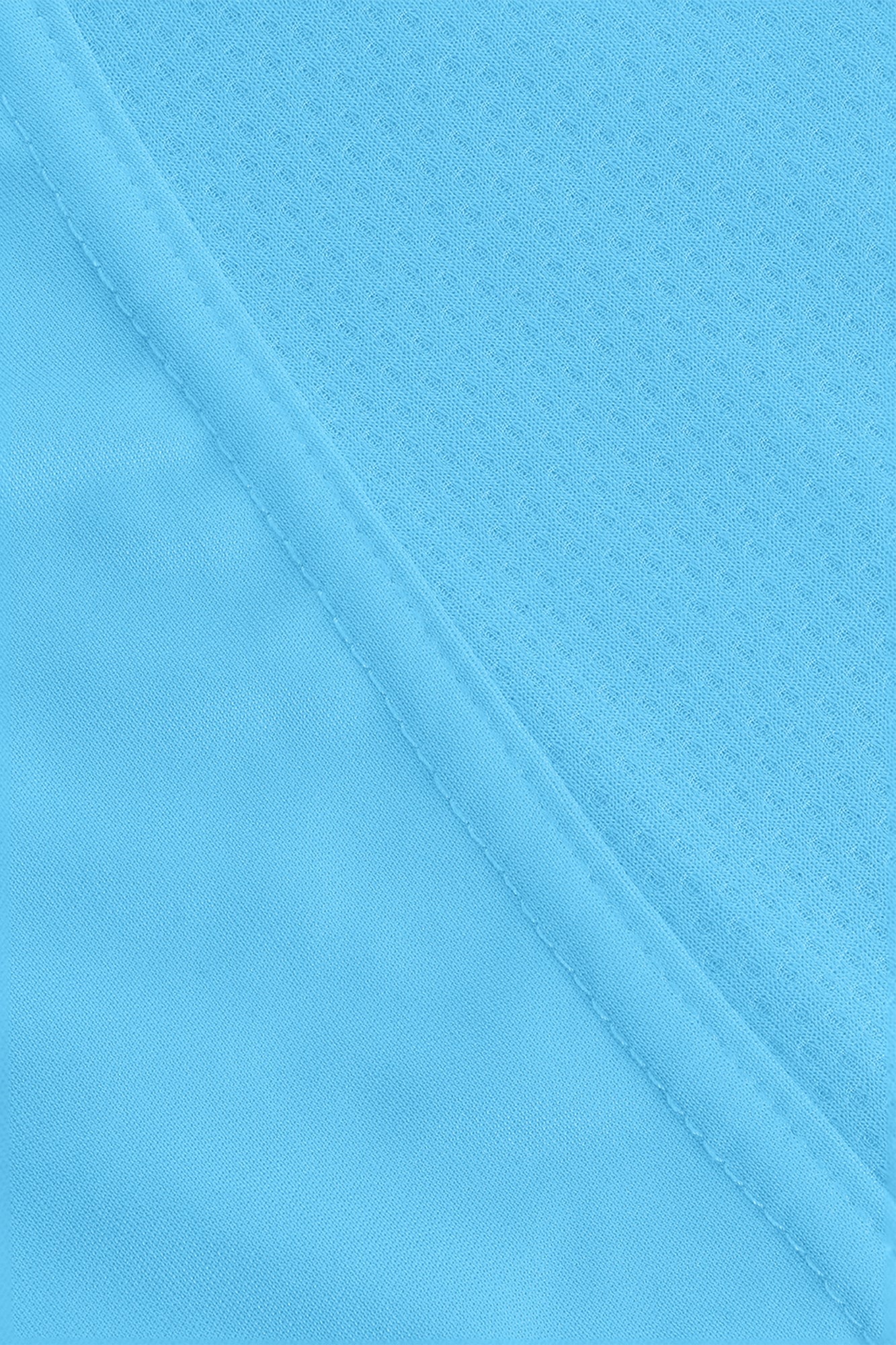 Osaka women singlet in light blue with logo in grey. Detail fabric view
