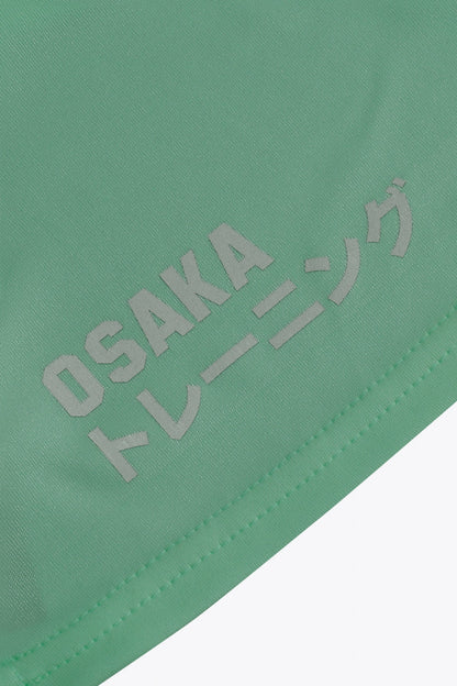 Osaka women singlet in green with logo in grey. Back flatlay detail logo view
