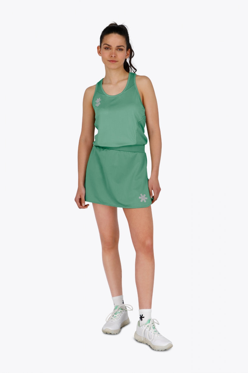 Woman wearing the Osaka women singlet in green with logo in grey. Front view