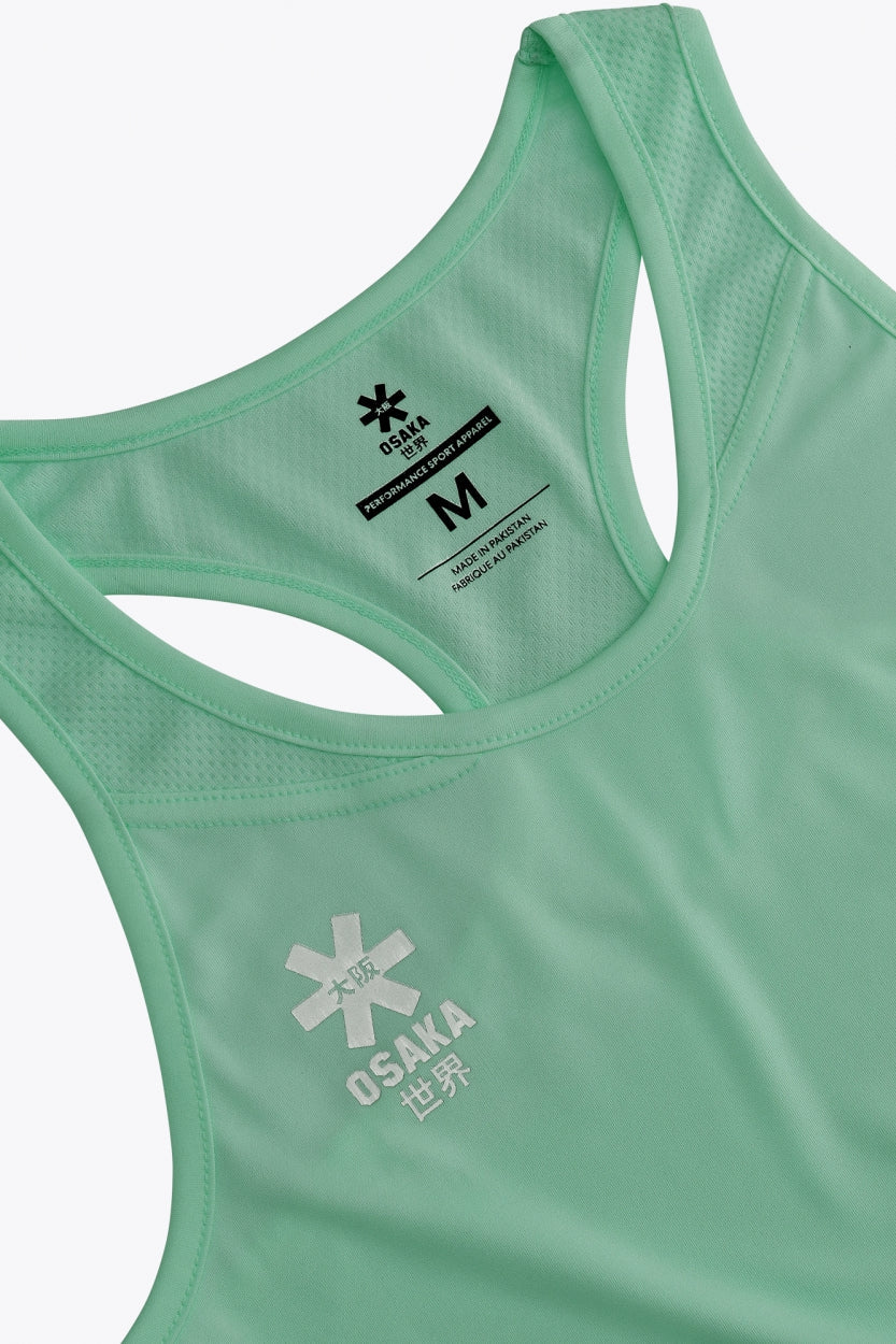 Osaka women singlet in green with logo in grey. Front flatlay view