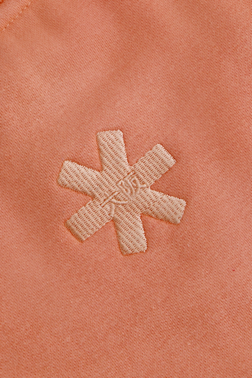 Osaka women sweater in peach with logo in white. Back detail logo view