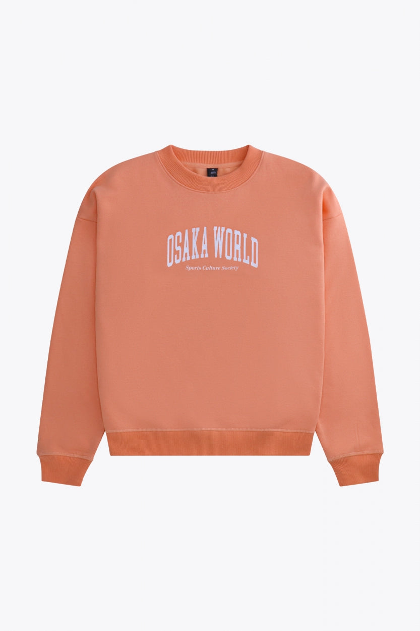 Osaka women sweater in peach with logo in white. Front flatlay view