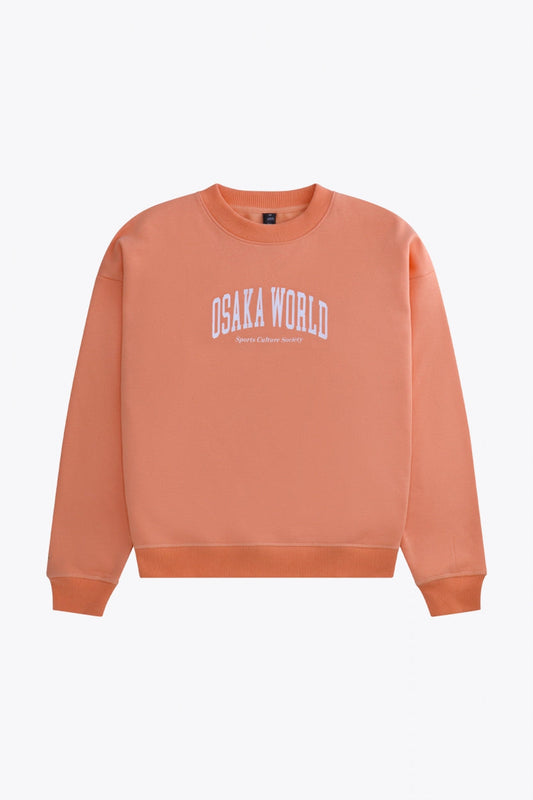 Osaka women sweater in peach with logo in white. Front flatlay view