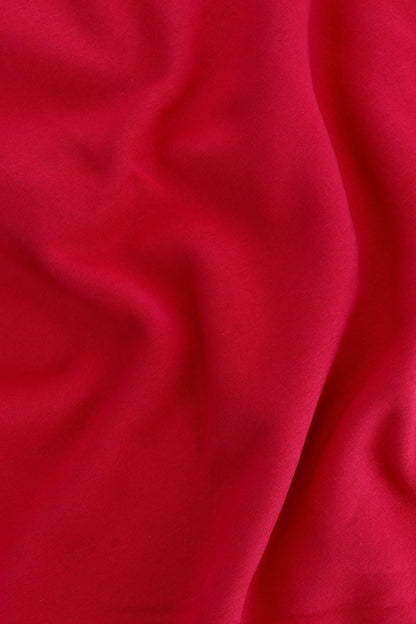 Osaka women sweater in red with logo in white. Detail fabric view